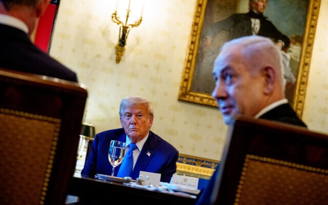 Prime Minister Benjamin Netanyahu, right, speaks as US President Donald Trump looks on during a dinner in the Blue Room of the White House in Washington, July 7, 2025. (Andrew Harnik/Getty Images/AFP) Prime Minister Benjamin Netanyahu, right, speaks as US President Donald Trump looks on during a dinner in the Blue Room of the White House in Washington, July 7, 2025. (Andrew Harnik/Getty Images/AFP)