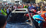 Illustrative: Paramedics inspect a burnt vehicle, which was targeted in an Israeli airstrike, in the Ayrouniyeh area near Lebanon's northern port city of Tripoli on July 8, 2025.(Photo by Fathi AL-MASRI / AFP)