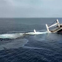 This handout picture released by Yemen's Houthi Ansarullah Media Centre on July 8, 2025 reportedly shows the Liberia-flagged bulk carrier Eternity sinking C after it was attacked by the Houthis at sea. (Photo by ANSARULLAH MEDIA CENTRE / AFP)
