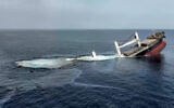 This handout picture released by the Houthi group's Ansarullah Media Centre on July 8, 2025, reportedly shows the Liberia-flagged bulk carrier Eternity C sinking after it was attacked by the Houthis at sea. (ANSARULLAH MEDIA CENTRE / AFP)
