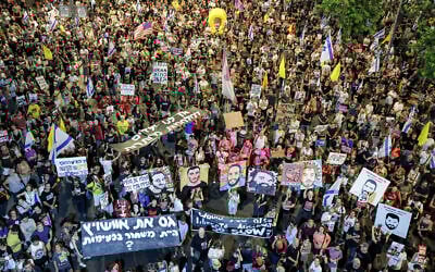 Demonstrators gather during an anti-government protest calling for action to secure the release hostages held captive in the Gaza Strip, outside the IDF headquarters in Tel Aviv on July 12, 2025. (Jack GUEZ / AFP)