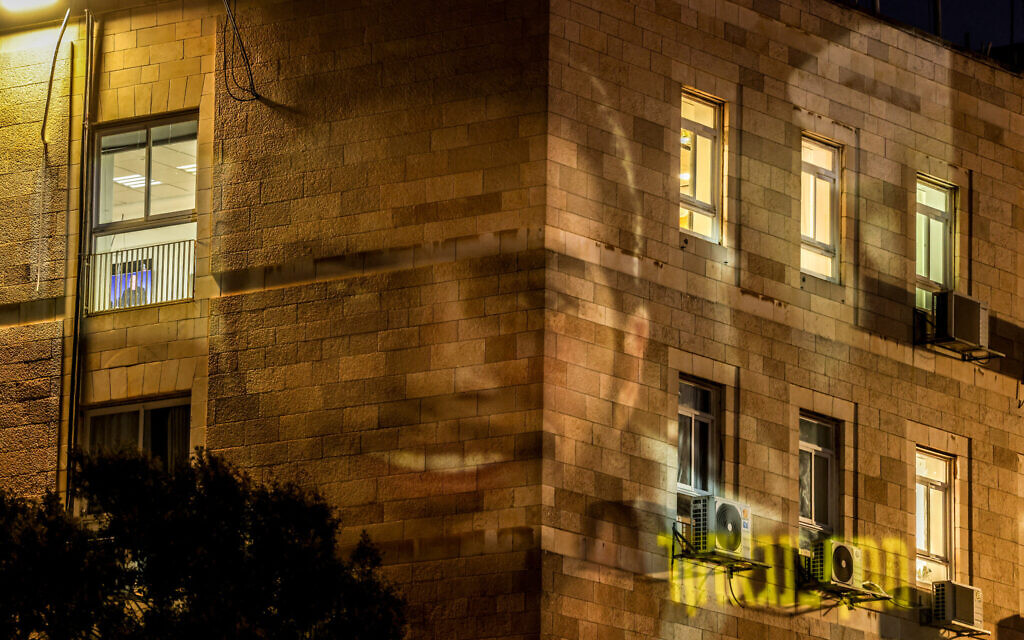 A portrait of Matan Zangauker, held hostage in the Gaza Strip since October 7, 2023, is projected onto a building during a protest outside the prime minister's residence in Jerusalem on July 13, 2025 (HAZEM BADER / AFP)