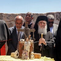 Latin Patriarch of Jerusalem Pierbattista Pizzaballa (L), Greek Orthodox Patriarch of Jerusalem Theophilos III (2nd-R), and Armenian Patriarch of Jerusalem Nourhan Manougian (R) stand together during a visit by the head clergymen of several Christian denominations to the fifth-century Church of St George in the Palestinian Christian village of Taybeh, northeast of Ramallah in West Bank on July 14, 2025, days after an arson attack on the site reportedly committed by Israeli settlers. (Zain JAAFAR / AFP)