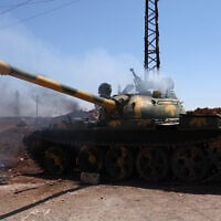 A burning tank in the Mazraa area, near Sweida, Syria, on July 14, 2025. (Bakr ALkasem / AFP)
