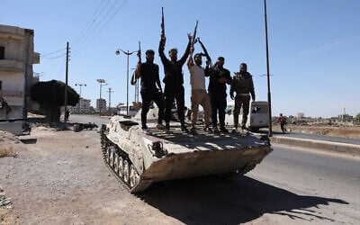 Members of Syria's security forces stand on a tank in the predominantly Druze city of Sweida on July 15, 2025, following clashes between Bedouin tribes and Druze fighters. (Bakr Alkasem / AFP) Members of Syria's security forces stand on a tank in the predominantly Druze city of Sweida on July 15, 2025, following clashes between Bedouin tribes and Druze fighters. (Bakr Alkasem / AFP)