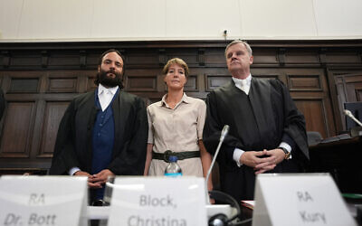Defendant German entrepreneur and gastronome Christina Block (C) stands next to her lawyers Ingo Bott (L) and Otmar Kury ahead of the continuation of the trial against her over alleged child abduction at the District Court in Hamburg, northern Germany, on July 15, 2025. (Marcus Brandt / POOL / AFP)
