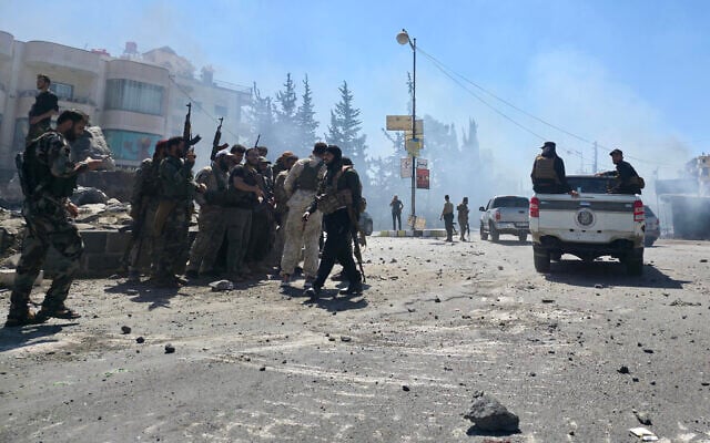 Syria's security forces enter the predominantly Druze city of Sweida on July 15, 2025, following clashes between Bedouin tribes and Druze fighters. (Sam HARIRI / AFP)