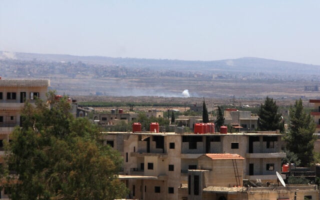 Smoke billows during Israeli strikes in the vicinity of Syria's southern city of Sweida on July 16, 2025. (Bakr ALKASEM / AFP)