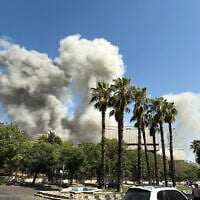 Smoke billows following Israeli strikes near the Syrian army and defense ministry headquarters in Damascus on July 16, 2025. (Rami al SAYED / AFP)