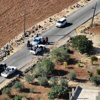 An aerial picture shows a view of Druze gunmen deploying in al-Dur village in Syria's southern Sweida governorate on July 17, 2025. (Omar HAJ KADOUR / AFP)