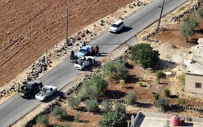 An aerial picture shows a view of Druze gunmen deploying in al-Dur village in Syria's southern Sweida governorate on July 17, 2025. (Omar HAJ KADOUR / AFP)