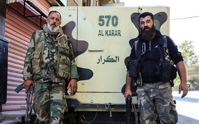 Syrian Druze fighters pose for a photograph after Syrian government forces pulled out of the southern Sweida governorate, on July 17, 2025. (Shadi AL-DUBAISI / AFP) Syrian Druze fighters pose for a photograph after Syrian government forces pulled out of the southern Sweida governorate, on July 17, 2025. (Shadi AL-DUBAISI / AFP)
