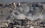 This picture taken from Israel's border with the Gaza Strip shows smoke billowing over destroyed buildings during an Israeli strike on July 17, 2025. (Jack Guez/AFP)