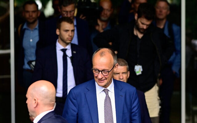 German Chancellor Friedrich Merz leaves after a press conference on home and foreign policy in Berlin, Germany, July 18, 2025. (John MACDOUGALL / AFP) German Chancellor Friedrich Merz leaves after a press conference on home and foreign policy in Berlin, Germany, July 18, 2025. (John MACDOUGALL / AFP)