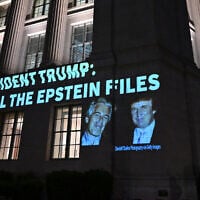 A message calling on US President Donald Trump to release all files related to Jeffrey Epstein is projected onto the US Chamber of Commerce building, across from the White House in Washington, on July 18, 2025. (Alex Wroblewski/AFP)