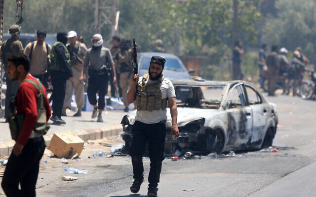 Bedouin tribal gunmen in a neighborhood in Sweida in Syria's southern province, despite an announcement by the Syrian interim president of an immediate ceasefire on July 19, 2025 (Bakr ALKASEM / AFP) Bedouin tribal gunmen in a neighborhood in Sweida in Syria's southern province, despite an announcement by the Syrian interim president of an immediate ceasefire on July 19, 2025 (Bakr ALKASEM / AFP)