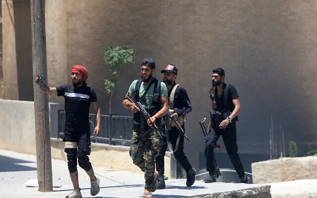 Bedouin tribal gunmen in a neighborhood in Sweida in Syria's southern province, despite an announcement by the Syrian interim president of an immediate ceasefire on July 19, 2025 (Bakr ALKASEM / AFP) Bedouin tribal gunmen in a neighborhood in Sweida in Syria's southern province, despite an announcement by the Syrian interim president of an immediate ceasefire on July 19, 2025 (Bakr ALKASEM / AFP)