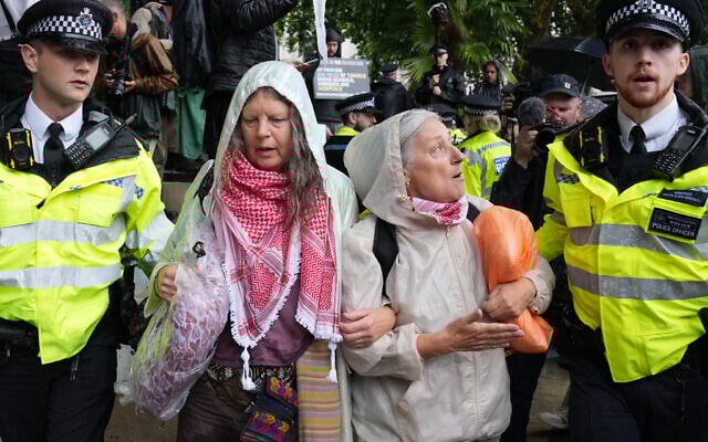 Protesters are escorted away by police officers at a demonstration in support of the proscribed group Palestine Action in Parliament Square, central London, on July 19, 2025 (CARLOS JASSO / AFP) Protesters are escorted away by police officers at a demonstration in support of the proscribed group Palestine Action in Parliament Square, central London, on July 19, 2025 (CARLOS JASSO / AFP)