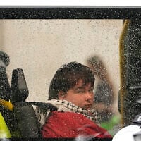 A protester is seen in a police van after being detained during a demonstration calling for the ban on Palestine Action, proscribed under anti-terrorism laws, to be lifted, in Parliament Square, central London, on July 19, 2025. (CARLOS JASSO / AFP)