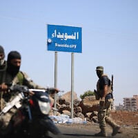 Tribal and Bedouin fighters deploy in the western neighborhood of southern Syria's predominantly Druze city of Sweida, amid clashes with Druze fighters on July 19, 2025. (Abdulaziz Ketaz/AFP)