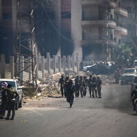 Tribal and bedouin fighters gather in the western neighborhood of southern Syria's predominantly Druze city of Sweida, amid clashes with Druze gunmen on July 19, 2025. (Abdulaziz Ketaz/AFP)