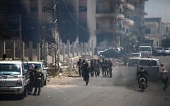 Tribal and bedouin fighters gather in the western neighborhood of southern Syria's predominantly Druze city of Sweida, amid clashes with Druze gunmen on July 19, 2025. (Abdulaziz Ketaz/AFP)