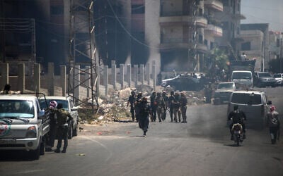 Tribal and Bedouin fighters gather in the western neighborhood of southern Syria's predominantly Druze city of Sweida, amid clashes with Druze gunmen on July 19, 2025. (Abdulaziz Ketaz/AFP)