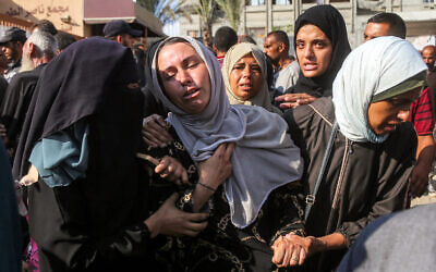 Women mourn during the funeral of victims allegedly killed the previous day by Israeli strikes, at Nasser Medical Complex in Khan Younis in the southern Gaza Strip on July 20, 2025. (AFP)