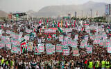 Yemenis lift placards and flags during a rally in solidarity with Palestinians and in condemnation of Israel and the US, in the Houthi-run capital Sanaa on July 25, 2025. (Mohammed HUWAIS / AFP)