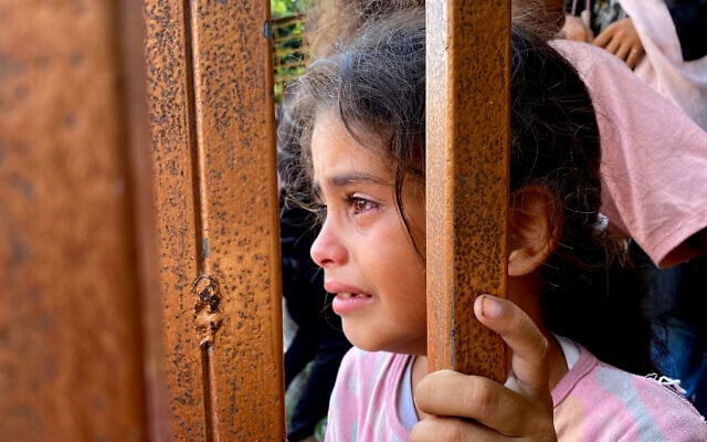Image of Gazan child with genetic illness being used to falsely smear Israel, COGAT charges 4 AFP 20250728 682F98W v1 HighRes PalestinianIsraelConflictGaza