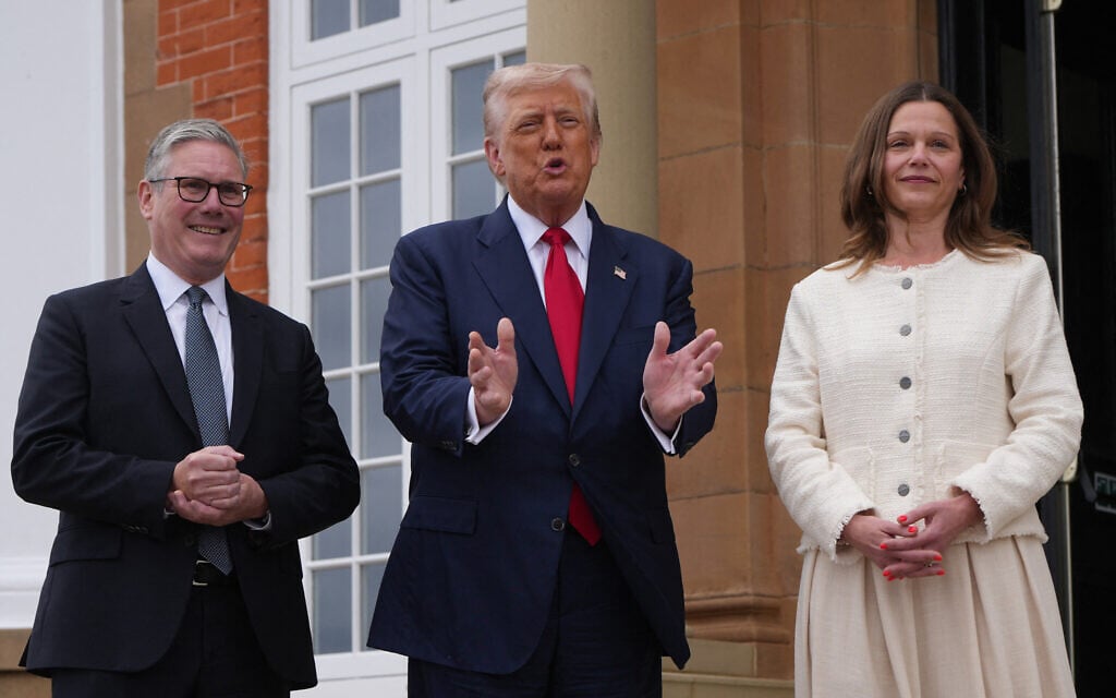 US President Donald Trump (R) and Britain's Prime Minister Keir Starmer (C) speak with members of the media prior to a bilateral meeting at the Trump Turnberry Golf Courses, in Turnberry south west Scotland on July 28, 2025 as Victoria Starmer (R) stands by. (Christopher Furlong / POOL / AFP)