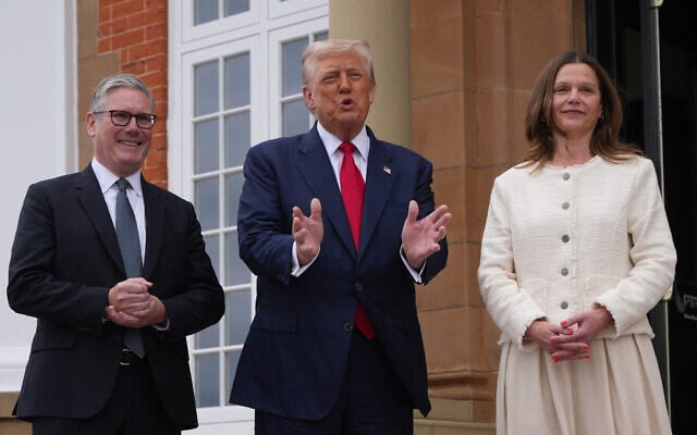 US President Donald Trump (R) and Britain's Prime Minister Keir Starmer (C) speak with members of the media prior to a bilateral meeting at the Trump Turnberry Golf Courses, in Turnberry south west Scotland on July 28, 2025 as Victoria Starmer (R) stands by. (Christopher Furlong / POOL / AFP)
