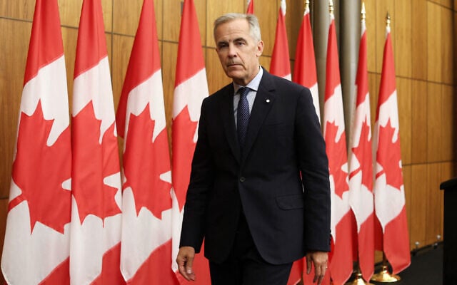 Canadian Prime Minister Mark Carney leaves after speaking during a press conference after a Cabinet meeting to discuss both trade negotiations with the US and the situation in the Middle East, at the National Press Theatre in Ottawa, Ontario, Canada on July 30, 2025. (Dave Chan / AFP) Canadian Prime Minister Mark Carney leaves after speaking during a press conference after a Cabinet meeting to discuss both trade negotiations with the US and the situation in the Middle East, at the National Press Theatre in Ottawa, Ontario, Canada on July 30, 2025. (Dave Chan / AFP)