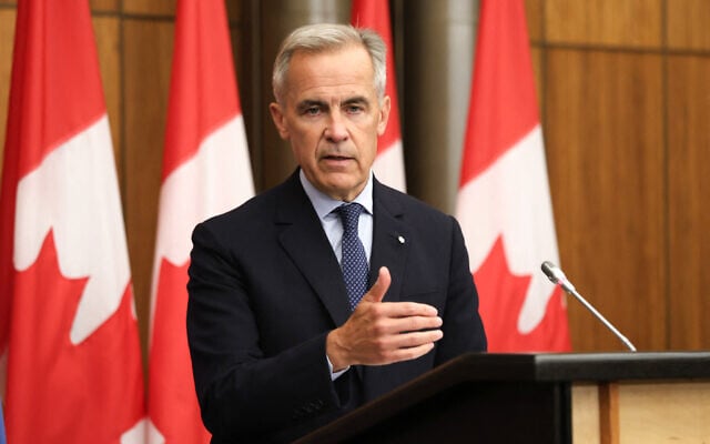 Canadian Prime Minister Mark Carney speaks during a press conference after a cabinet meeting to discuss both trade negotiations with the US and the situation in the Middle East, at the National Press Theatre in Ottawa, Ontario, Canada, on July 30, 2025. (Dave Chan/AFP)