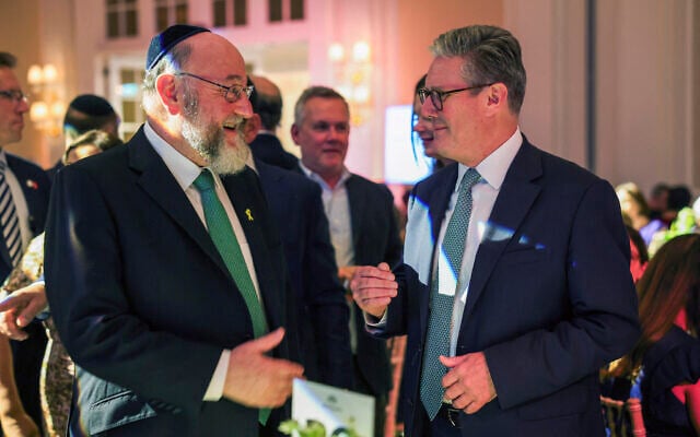 British Prime Minister Keir Starmer speaks with Chief Rabbi Ephraim Mirvis, at the Holocaust Education Trust appeal dinner, in London, Monday, Sept. 16, 2024. (Isabel Infantes/Pool via AP)