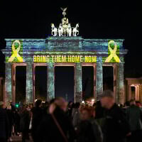 The Brandenburg Gate is illuminated in solidarity with Israel, marking the first anniversary of the Hamas-led attacks on Israel, in Berlin, Germany, Monday, Oct. 7, 2024. (AP/Markus Schreiber)
