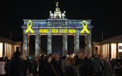The Brandenburg Gate is illuminated in solidarity with Israel, marking the first anniversary of the Hamas-led attacks on Israel, in Berlin, Germany, Monday, Oct. 7, 2024. (AP/Markus Schreiber)