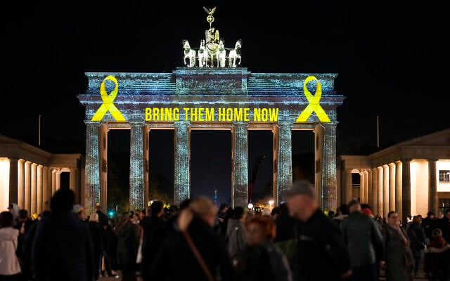 The Brandenburg Gate is illuminated in solidarity with Israel, marking the first anniversary of the Hamas-led attacks on Israel, in Berlin, Germany, Monday, Oct. 7, 2024. (AP/Markus Schreiber)
