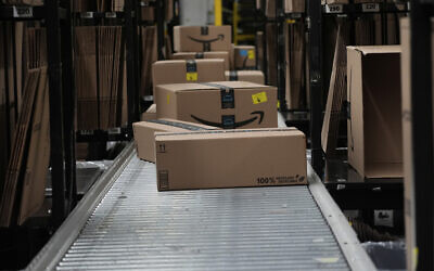 Boxes sit on a conveyor belt at an Amazon storage warehouse in Tepotzotlan, Mexico, May 22, 2025. (AP Photo/Marco Ugarte)