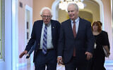 US Senators Bernie Sanders, left, and Chris Van Hollen walk to the chamber for votes at the Capitol in Washington, June 11, 2025. (AP Photo/J. Scott Applewhite)