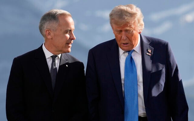Canada's Prime Minister Mark Carney, left, talks with US President Donald Trump before a group photo at the G7 Summit, June 16, 2025, in Kananaskis, Canada. (AP Photo/Mark Schiefelbein) Canada's Prime Minister Mark Carney, left, talks with US President Donald Trump before a group photo at the G7 Summit, June 16, 2025, in Kananaskis, Canada. (AP Photo/Mark Schiefelbein)