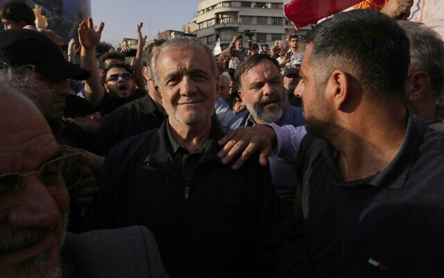 Iranian President Masoud Pezeshkian attends a protest following the US attacks on nuclear sites in Iran, in Tehran, Iran, June 22, 2025. (AP Photo/Vahid Salemi)