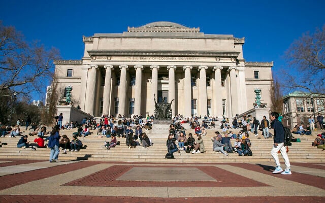 FILE - Students sit on the front steps of Low Memorial Library on the Columbia University campus in New York City, February 10, 2023. (AP Photo/Ted Shaffrey, File)