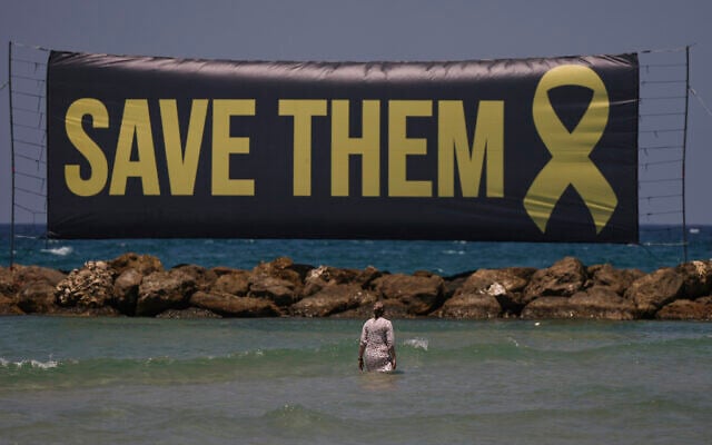 A banner, referring to the hostages being held by Hamas in the Gaza Strip, is displayed on the beach in Tel Aviv, Israel, Friday, July 4, 2025. (AP Photo/Oded Balilty) A banner, referring to the hostages being held by Hamas in the Gaza Strip, is displayed on the beach in Tel Aviv, Israel, Friday, July 4, 2025. (AP Photo/Oded Balilty)