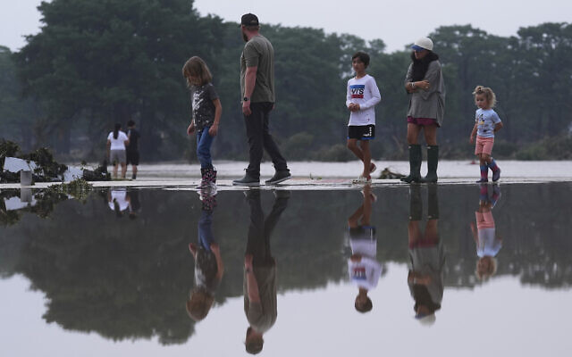 Onlookers survey damage along the Guadalupe River after a flash flood swept through the area, Friday, July 4, 2025, in Kerrville, Texas. (AP Photo/Eric Gay) Onlookers survey damage along the Guadalupe River after a flash flood swept through the area, Friday, July 4, 2025, in Kerrville, Texas. (AP Photo/Eric Gay)