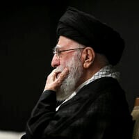 In this photo provided by the Office of the Iranian Supreme Leader, Supreme Leader Ayatollah Ali Khamenei attends the "Tasua" (ninth day) mourning ritual to commemorate martyrdom of Prophet Mohammad's grandson Imam Hussein, during the Islamic month of Muharram ahead of Ashura, July 5, 2025. (Office of the Iranian Supreme Leader via AP)