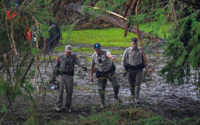 Officials inspect an area at Camp Mystic along the banks of the Guadalupe River after a flash flood swept through the area July 6, 2025, in Hunt, Texas. (AP Photo/Julio Cortez) Officials inspect an area at Camp Mystic along the banks of the Guadalupe River after a flash flood swept through the area July 6, 2025, in Hunt, Texas. (AP Photo/Julio Cortez)