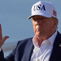 US President Donald Trump waves to the media after exiting Air Force One, at Joint Base Andrews, Maryland, July 6, 2025, en route to the White House after spending the weekend in New Jersey. (Jacquelyn Martin/AP)