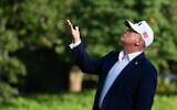 US President Donald Trump looks up at the American flag on the flagpole on the South Lawn as he arrives at the White House, July 6, 2025, in Washington. (AP/Manuel Balce Ceneta)