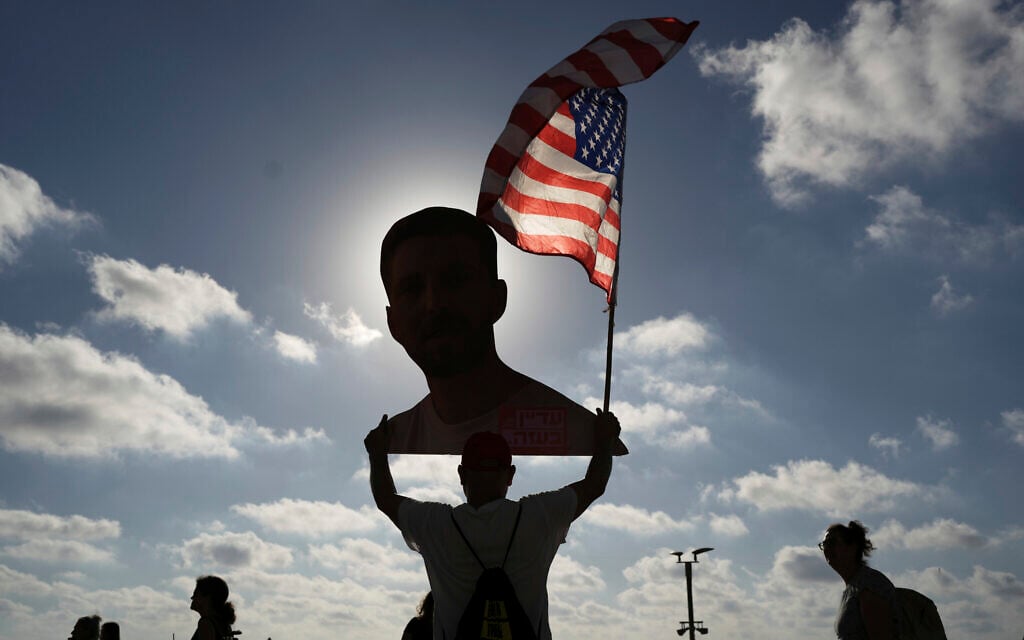 People attend a rally calling for the release of hostages held in the Gaza Strip and a ceasefire, in front of the US Embassy branch office in Tel Aviv on July 7, 2025. (AP/Oded Balilty)